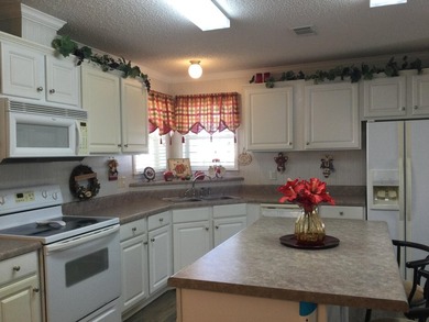 Meticulously maintained home in the much sought after Spanish on Spanish Lakes I in Florida - for sale on GolfHomes.com, golf home, golf lot