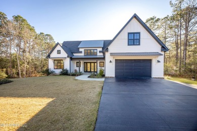 Nestled in a prestigious gated golf course community, this on Shell Landing Golf Club in Mississippi - for sale on GolfHomes.com, golf home, golf lot