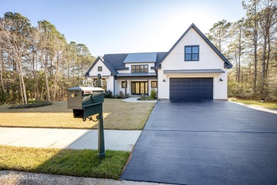 Nestled in a prestigious gated golf course community, this on Shell Landing Golf Club in Mississippi - for sale on GolfHomes.com, golf home, golf lot