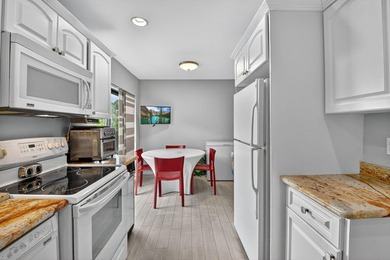 Welcome to your charming first-floor corner unit with beautiful on Hunters Run Golf and Country Club in Florida - for sale on GolfHomes.com, golf home, golf lot