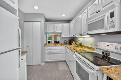 Welcome to your charming first-floor corner unit with beautiful on Hunters Run Golf and Country Club in Florida - for sale on GolfHomes.com, golf home, golf lot