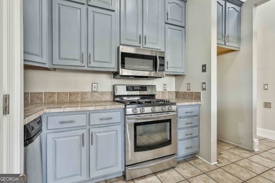 This spacious 5-bedroom, 5-bath home offers 4,405 square feet of on Canongate On White Oak Golf Course in Georgia - for sale on GolfHomes.com, golf home, golf lot