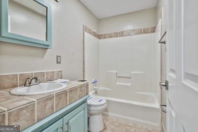 This spacious 5-bedroom, 5-bath home offers 4,405 square feet of on Canongate On White Oak Golf Course in Georgia - for sale on GolfHomes.com, golf home, golf lot