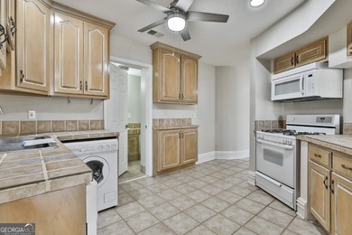 This spacious 5-bedroom, 5-bath home offers 4,405 square feet of on Canongate On White Oak Golf Course in Georgia - for sale on GolfHomes.com, golf home, golf lot