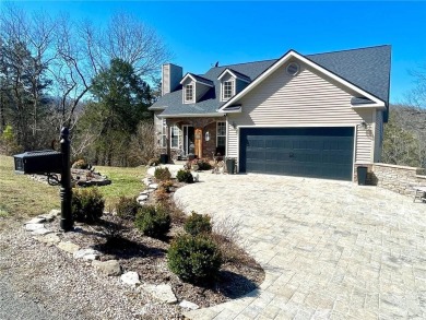 The cobblestone drive and walkway set the tone for this home's on Holiday Island Executive Golf Course in Arkansas - for sale on GolfHomes.com, golf home, golf lot