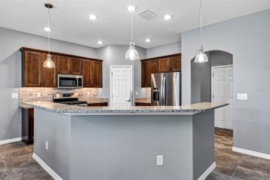 IMMACULATELY MAINTAINED 3 BEDROOM, 2 BATH LOW-MAINTENANCE STUCCO on Arlington Ridge Golf Club in Florida - for sale on GolfHomes.com, golf home, golf lot