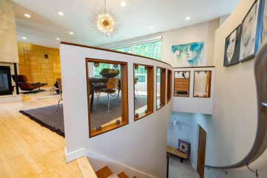 This Mid-Century Modern masterpiece is located near Lake on Grand Haven Golf Club in Michigan - for sale on GolfHomes.com, golf home, golf lot