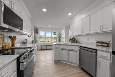 Nestled in a serene, nature-filled environment, this beautifully on Harbour Point Golf Club in North Carolina - for sale on GolfHomes.com, golf home, golf lot
