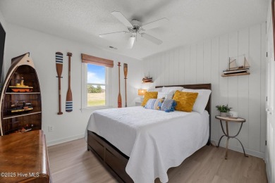 Nestled in a serene, nature-filled environment, this beautifully on Harbour Point Golf Club in North Carolina - for sale on GolfHomes.com, golf home, golf lot