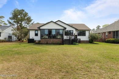 Nestled in a serene, nature-filled environment, this beautifully on Harbour Point Golf Club in North Carolina - for sale on GolfHomes.com, golf home, golf lot