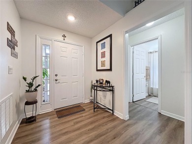 Walk into this modernized Canterbury model located in 55+ gated on Kings Ridge Golf Club in Florida - for sale on GolfHomes.com, golf home, golf lot