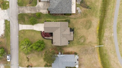 Nestled in a serene, nature-filled environment, this beautifully on Harbour Point Golf Club in North Carolina - for sale on GolfHomes.com, golf home, golf lot