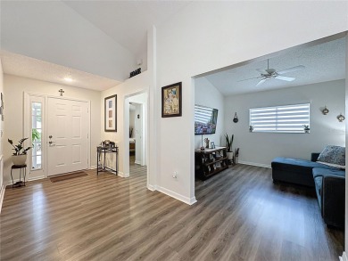 Walk into this modernized Canterbury model located in 55+ gated on Kings Ridge Golf Club in Florida - for sale on GolfHomes.com, golf home, golf lot