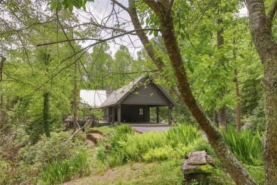 Discover this Holly Forest home in a one-of-a-kind setting with on Sapphire National Golf Club in North Carolina - for sale on GolfHomes.com, golf home, golf lot