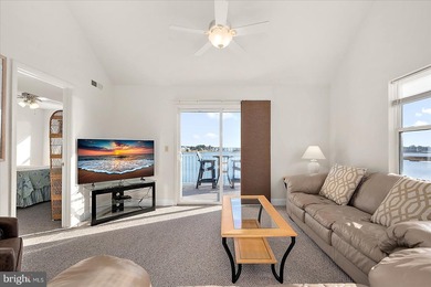 Discover waterfront living at its finest in this top floor, end on Bethany Bay Golf Club in Delaware - for sale on GolfHomes.com, golf home, golf lot