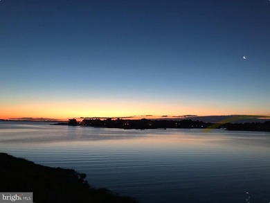 Discover waterfront living at its finest in this top floor, end on Bethany Bay Golf Club in Delaware - for sale on GolfHomes.com, golf home, golf lot