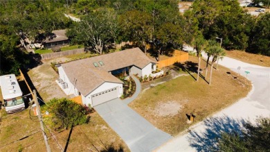 Live the Florida Dream in this Stunning Corner Lot Home on 1/3 on Heather Golf and Country Club in Florida - for sale on GolfHomes.com, golf home, golf lot