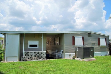 Updated and move-in ready, this residence is nestled in the on Six Lakes Country Club in Florida - for sale on GolfHomes.com, golf home, golf lot