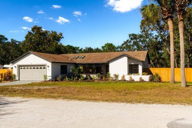 Live the Florida Dream in this Stunning Corner Lot Home on 1/3 on Heather Golf and Country Club in Florida - for sale on GolfHomes.com, golf home, golf lot