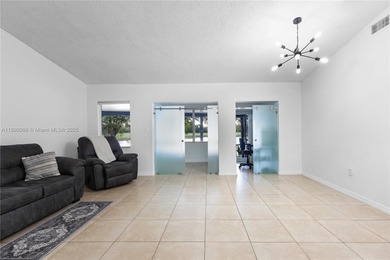 Charming One-Story Home with Golf and Lake Views in Doral Park! on Doral Golf Resort in Florida - for sale on GolfHomes.com, golf home, golf lot
