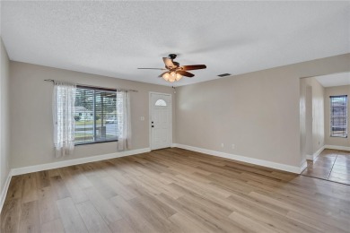 Welcome to this beautifully updated 2 bedroom 2 bath home on Highland Lakes Executive Golf Course in Florida - for sale on GolfHomes.com, golf home, golf lot
