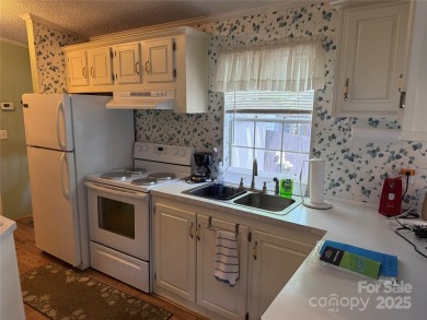 Welcome to 102 Papoose Ct. This 1999 Park Model is in great on The Tillery Tradition Country Club in North Carolina - for sale on GolfHomes.com, golf home, golf lot