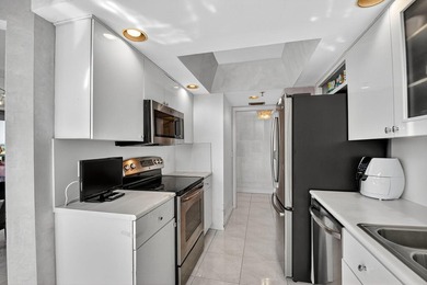 Spectacular golf, lake & tropical garden views from your wrap on Fountains Golf and Country Club in Florida - for sale on GolfHomes.com, golf home, golf lot