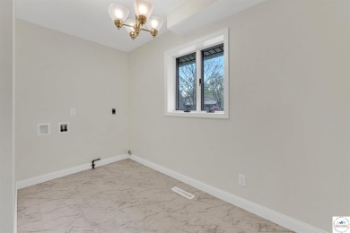 This expansive residence in Sedalia, MO, offers generous living on Sedalia Country Club in Missouri - for sale on GolfHomes.com, golf home, golf lot