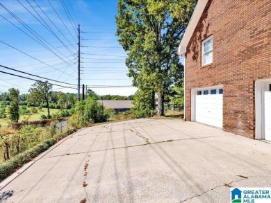 Nestled on a peaceful street in Woodland Hills, this charming on Frank House Municipal Golf Course in Alabama - for sale on GolfHomes.com, golf home, golf lot