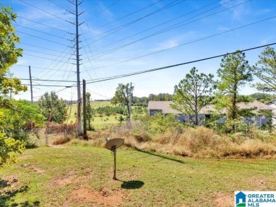 Nestled on a peaceful street in Woodland Hills, this charming on Frank House Municipal Golf Course in Alabama - for sale on GolfHomes.com, golf home, golf lot