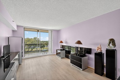 Spectacular golf, lake & tropical garden views from your wrap on Fountains Golf and Country Club in Florida - for sale on GolfHomes.com, golf home, golf lot