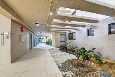 Spectacular golf, lake & tropical garden views from your wrap on Fountains Golf and Country Club in Florida - for sale on GolfHomes.com, golf home, golf lot