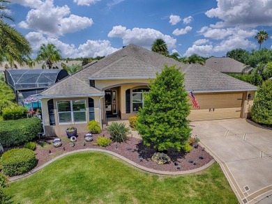 Surrounded by lush, mature landscaping, this beautiful Aspen- on The Links of Spruce Creek in Florida - for sale on GolfHomes.com, golf home, golf lot