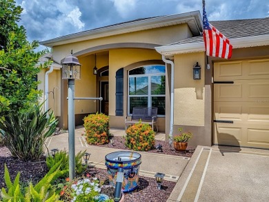 Surrounded by lush, mature landscaping, this beautiful Aspen- on The Links of Spruce Creek in Florida - for sale on GolfHomes.com, golf home, golf lot