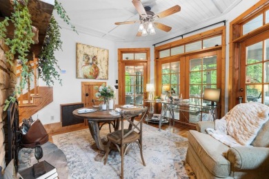 This charming bungalow is nestled in the woods within the quiet on Trillium Links in North Carolina - for sale on GolfHomes.com, golf home, golf lot