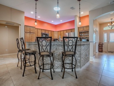 Surrounded by lush, mature landscaping, this beautiful Aspen- on The Links of Spruce Creek in Florida - for sale on GolfHomes.com, golf home, golf lot