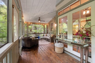 This charming bungalow is nestled in the woods within the quiet on Trillium Links in North Carolina - for sale on GolfHomes.com, golf home, golf lot