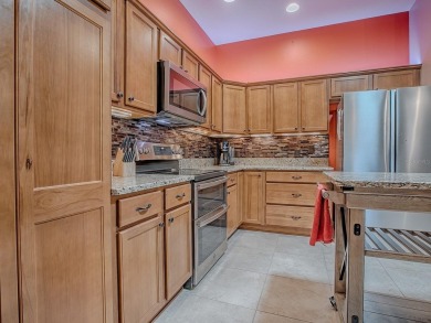 Surrounded by lush, mature landscaping, this beautiful Aspen- on The Links of Spruce Creek in Florida - for sale on GolfHomes.com, golf home, golf lot