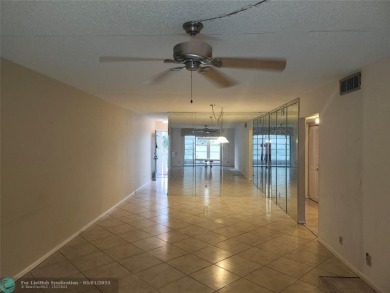 WYNMOOR--HOPA---MUST BE 55+ TO LIVE HERE-- LOCATED IN  A 24 HOUR on Wynmoor Golf Course in Florida - for sale on GolfHomes.com, golf home, golf lot