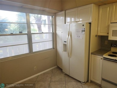 WYNMOOR--HOPA---MUST BE 55+ TO LIVE HERE-- LOCATED IN  A 24 HOUR on Wynmoor Golf Course in Florida - for sale on GolfHomes.com, golf home, golf lot