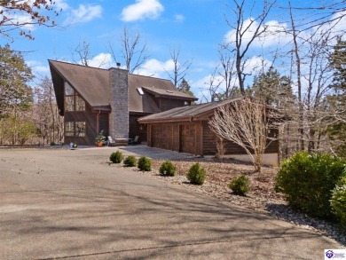 This is a custom Lindal Cedar Home that is designed to blend on Doe Valley Country Club in Kentucky - for sale on GolfHomes.com, golf home, golf lot