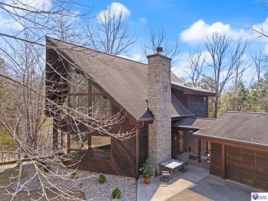 This is a custom Lindal Cedar Home that is designed to blend on Doe Valley Country Club in Kentucky - for sale on GolfHomes.com, golf home, golf lot