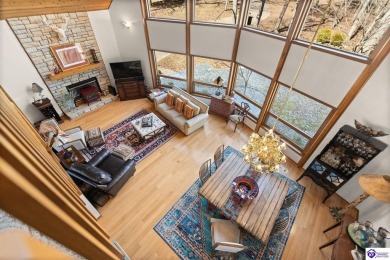 This is a custom Lindal Cedar Home that is designed to blend on Doe Valley Country Club in Kentucky - for sale on GolfHomes.com, golf home, golf lot