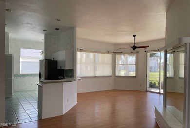 Located in a designated 55+ community, this three-bedroom home on Sabal Springs Golf and Racquet Club in Florida - for sale on GolfHomes.com, golf home, golf lot