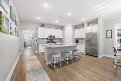 Experience the ease of coastal living in this impeccably on Surf Golf and Beach Club in South Carolina - for sale on GolfHomes.com, golf home, golf lot