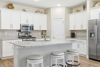 Experience the ease of coastal living in this impeccably on Surf Golf and Beach Club in South Carolina - for sale on GolfHomes.com, golf home, golf lot