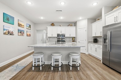 Experience the ease of coastal living in this impeccably on Surf Golf and Beach Club in South Carolina - for sale on GolfHomes.com, golf home, golf lot