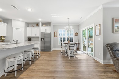 Experience the ease of coastal living in this impeccably on Surf Golf and Beach Club in South Carolina - for sale on GolfHomes.com, golf home, golf lot