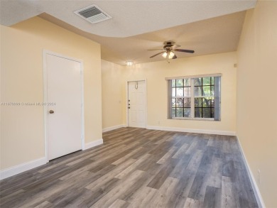 Highly renovated townhome conveniently located in the heart of on Jacaranda Golf Club in Florida - for sale on GolfHomes.com, golf home, golf lot