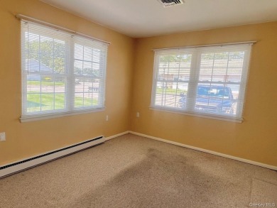 Corner unit Greenbriar with newer vinyl windows. Light and on Leisure Village Golf Course in New York - for sale on GolfHomes.com, golf home, golf lot